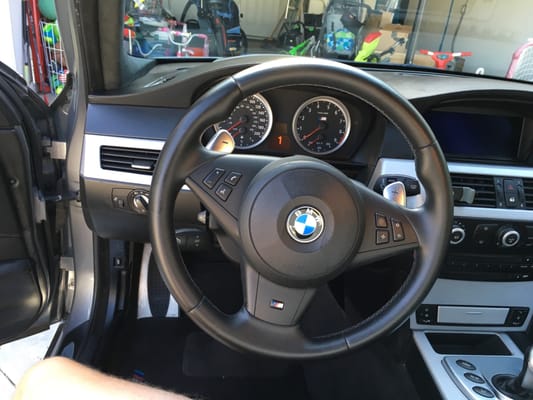 Leather-wrapped steering wheel inside a BMW